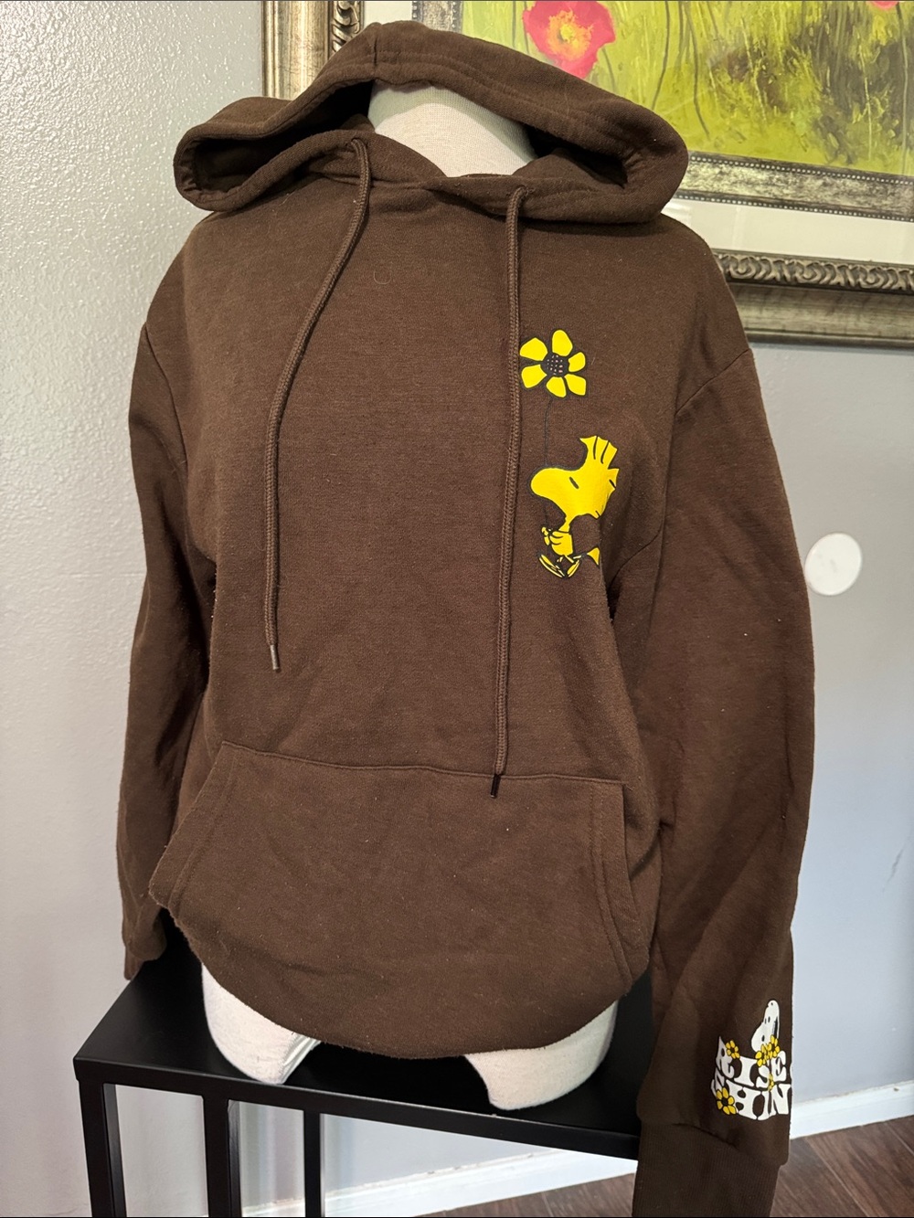 Brown Peanuts Snoopy hoodie with yellow Snoopy graphic and flower